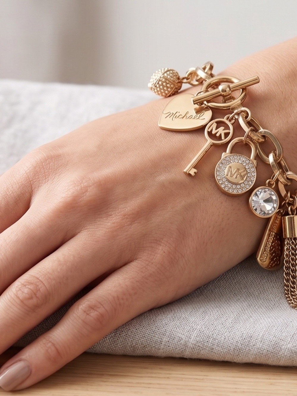 Michael Kors Gold Charm Bracelet with Crystal and Logo Discs